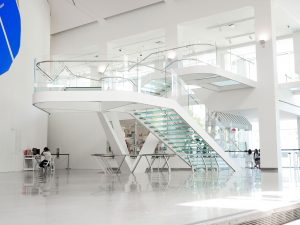 View from underneath the Queens Museum staircase, showing the low iron, laminated acid-etched walkable traction-glass stairs.