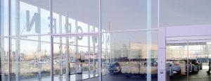 Exterior shot of Audi dealership featuring oversized, insulated glass units combining low-e and clear glass.