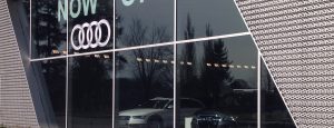 Exterior shot of Audi dealership featuring oversized, insulated glass units combining low-e and clear glass.