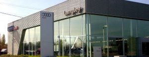 Exterior shot of Audi dealership featuring oversized, insulated glass units combining low-e and clear glass.