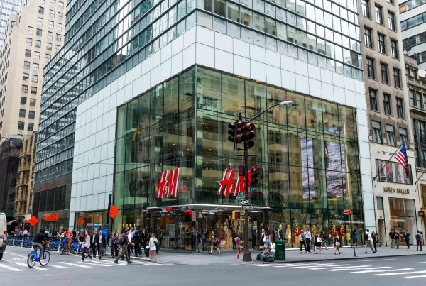 Across the street, corner view of H&M flagship store on 5th ave. Highlights the oversize laminated and insulated glass units.