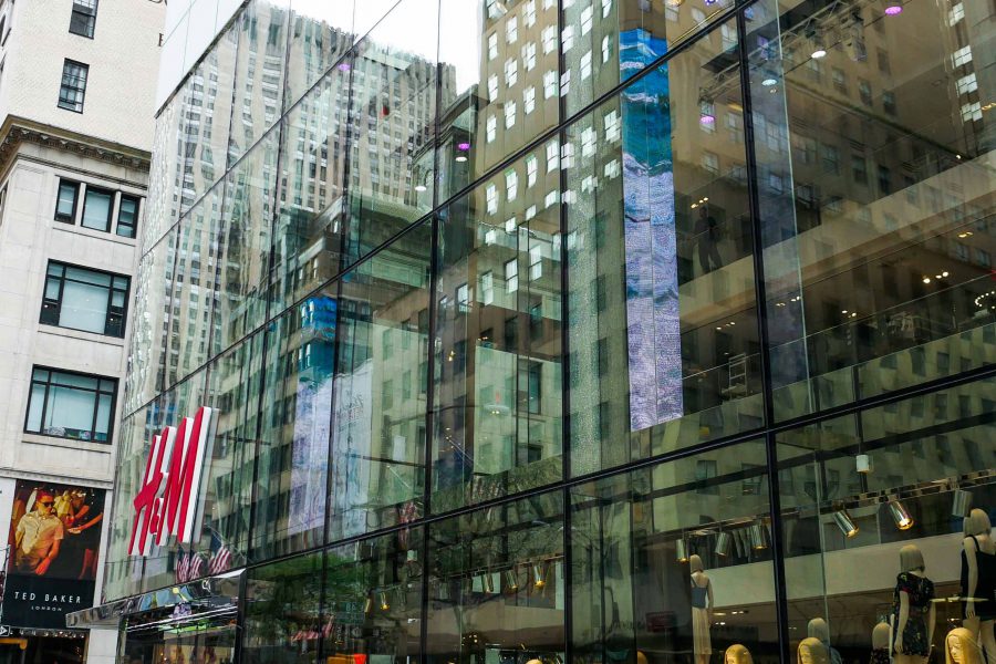 Sideview of view of H&M flagship store on 5th ave. Highlights the oversize laminated and insulated glass units.