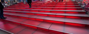 TKTS staircase, in Timesquare features low iron, acid-etch red backlit laminate treads.