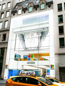 Street view of Microsoft's flagship store on 5th ave, Microsoft's Facade features oversize triple laminates.