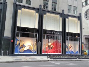 View of the corner of the Palmolive Building, featuring Louis Vuitton's storefront.