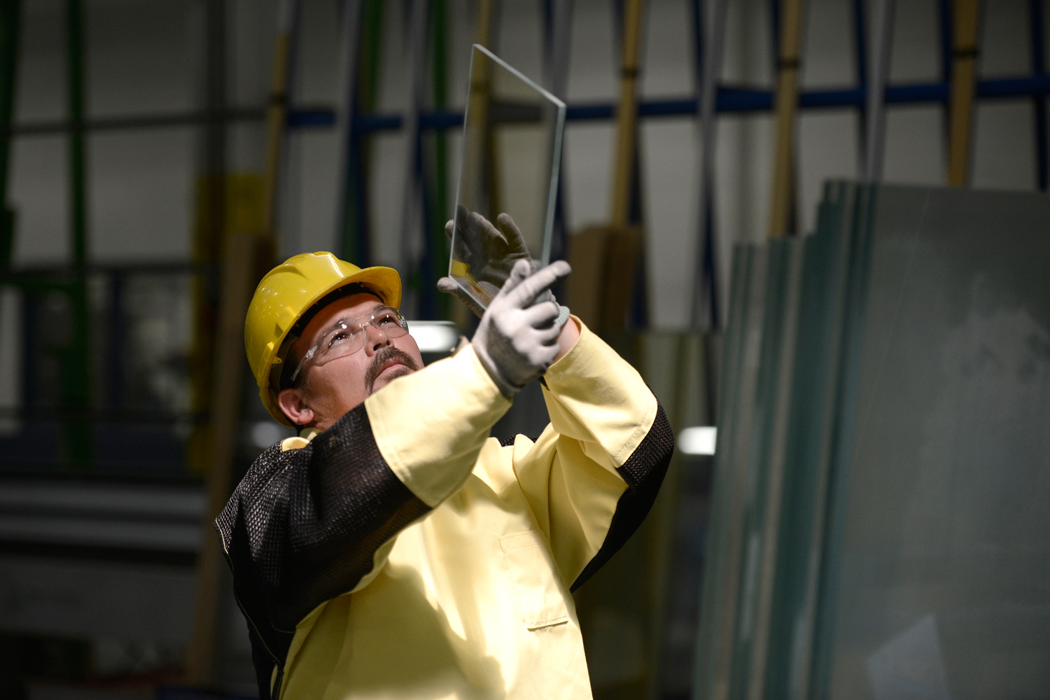 AGNORA Employee admiring edgework on sample glass