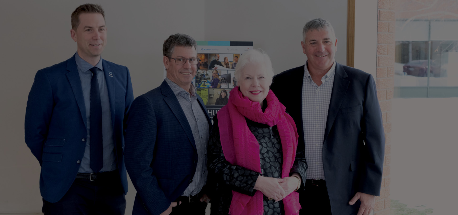 The Honourable Elizabeth Dowdswell and AGNORAs leadership team stand in the foyer of Agnora's Collingwood manufacturing facility